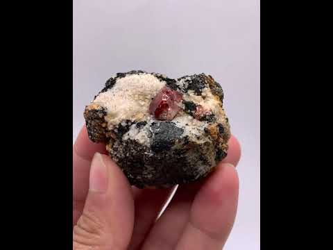 Vibrant Red Twinned Zircon crystals on Graphite matrix from Skardu, Pakistan