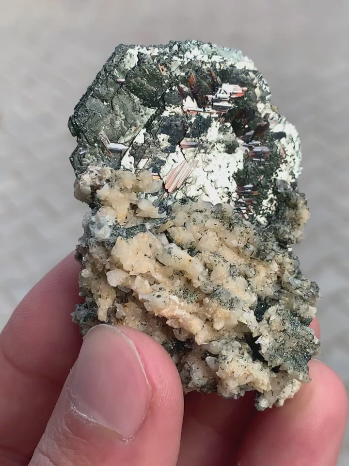 Lusterious Hematite With Rutile Spikes On Albite Matrix