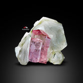 Vibrant Pink Tourmaline nicely positioned on Smoky Quartz