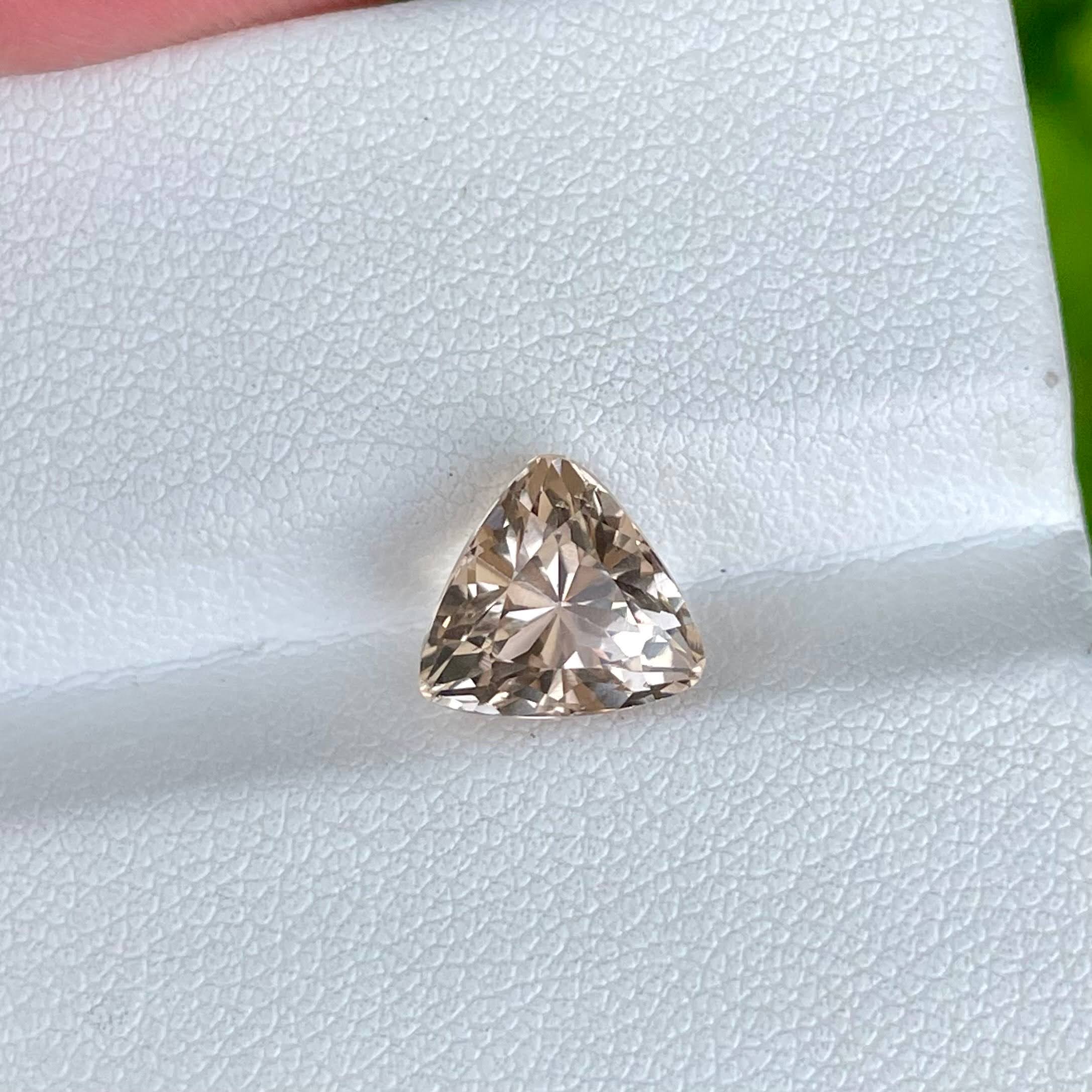 Buy 3.80 Carats Peach Topaz Trillion Cut | at GandharaGems | Gandhara Gems