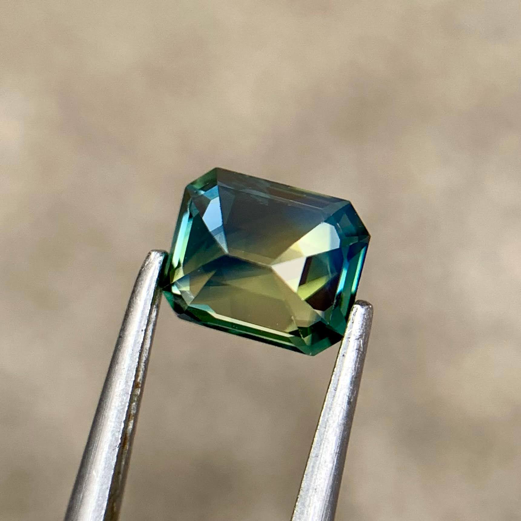 1-16ct-natural-bicolor-sapphire-madagascar-emerald-cut