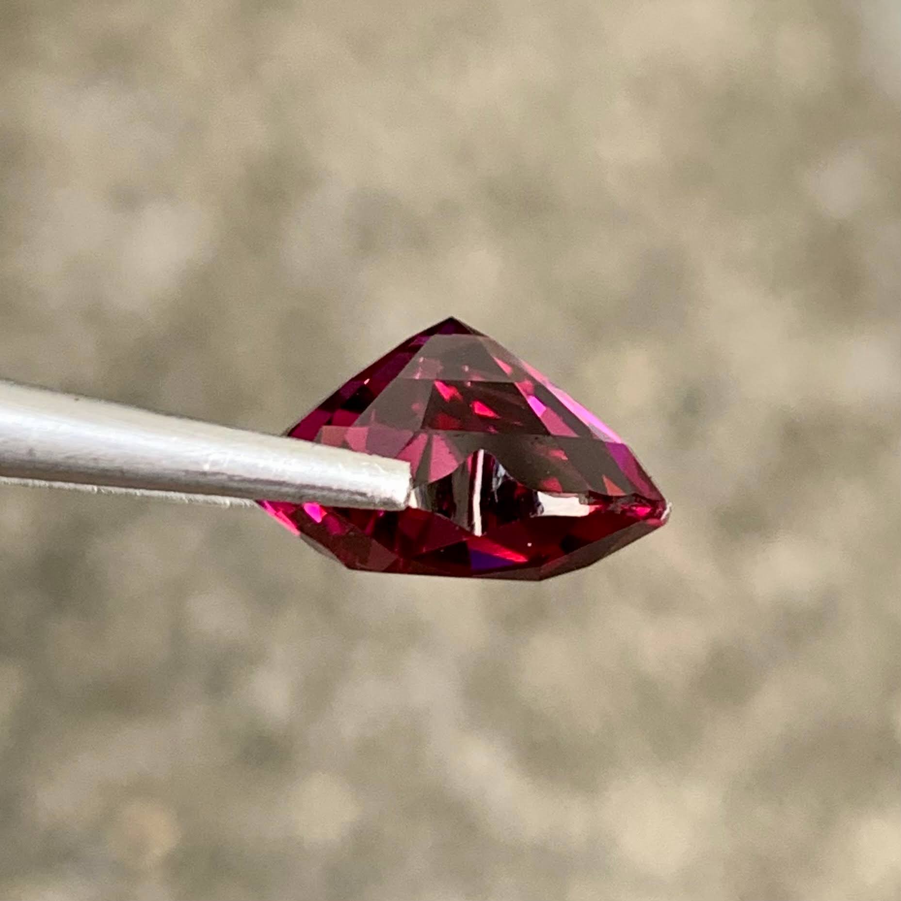 6-28-carats-vivid-reddish-pink-garnet-heart-faceted-cut-natural-nigerian-gemstone