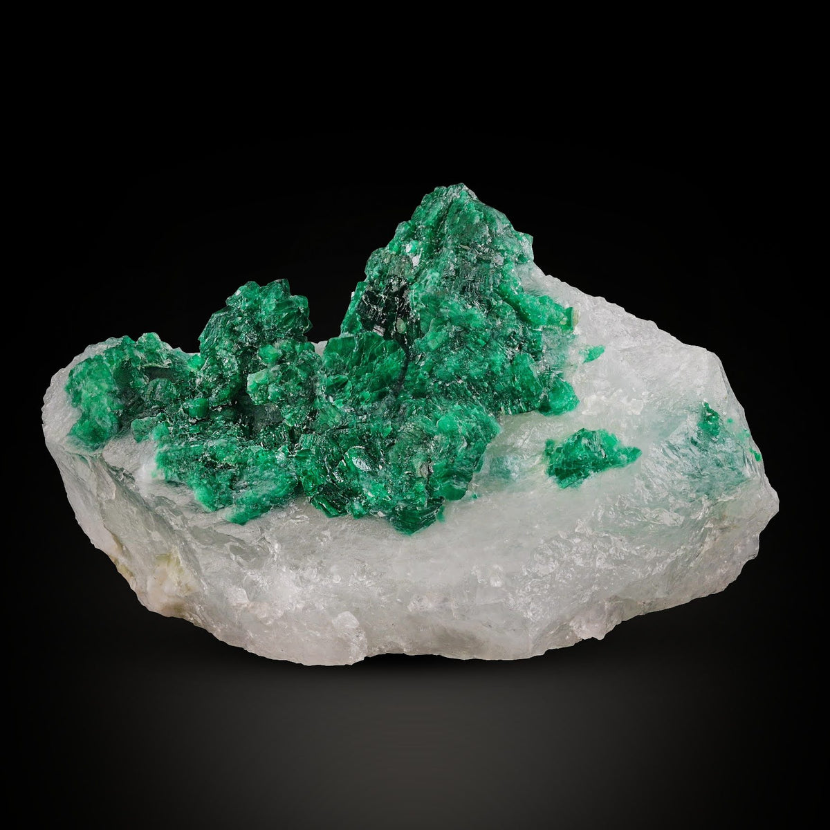 Vibrant Emerald Crystal on Calcite