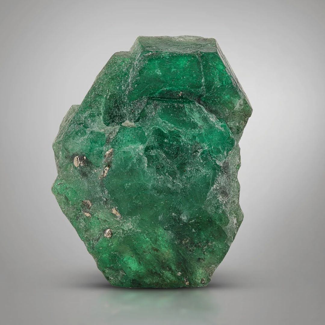 Green Color Emerald Crystals on Pyrite