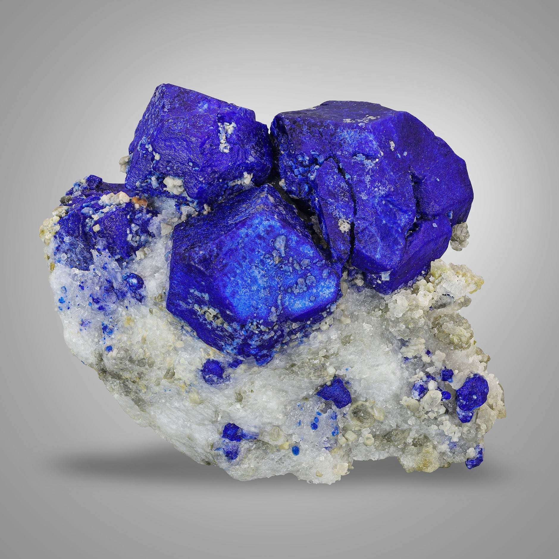 Isometric sapphire blue color Lazurite trio crystals on Calcite with Pyrite from Badakhshan, Afghanistan