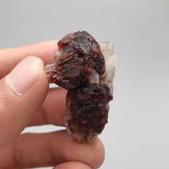 Red Spessartine Garnet Crystals On Quartz